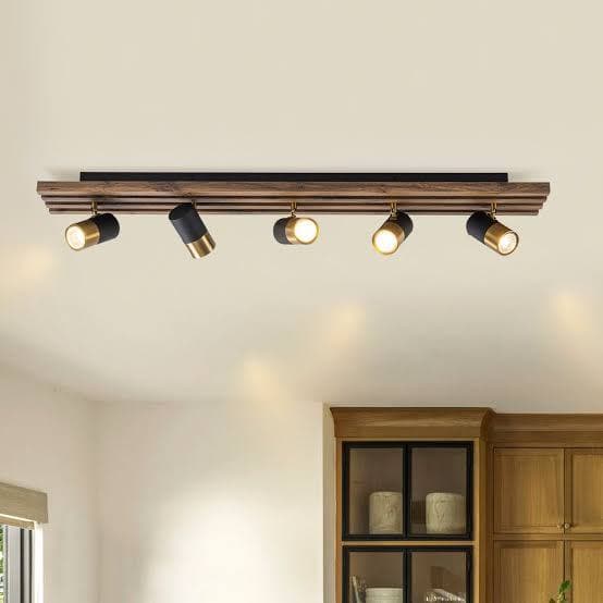 Panelled ceiling with a framed track-lighting layout above restaurant tables