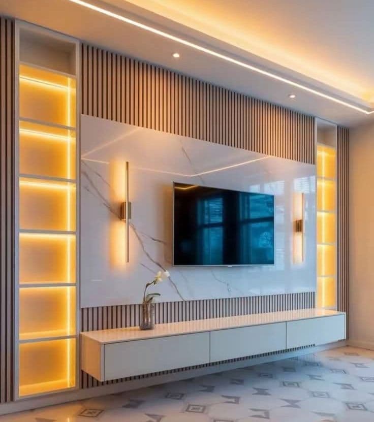 Dark textured curved feature wall lit by a warm concealed LED strip along its edge